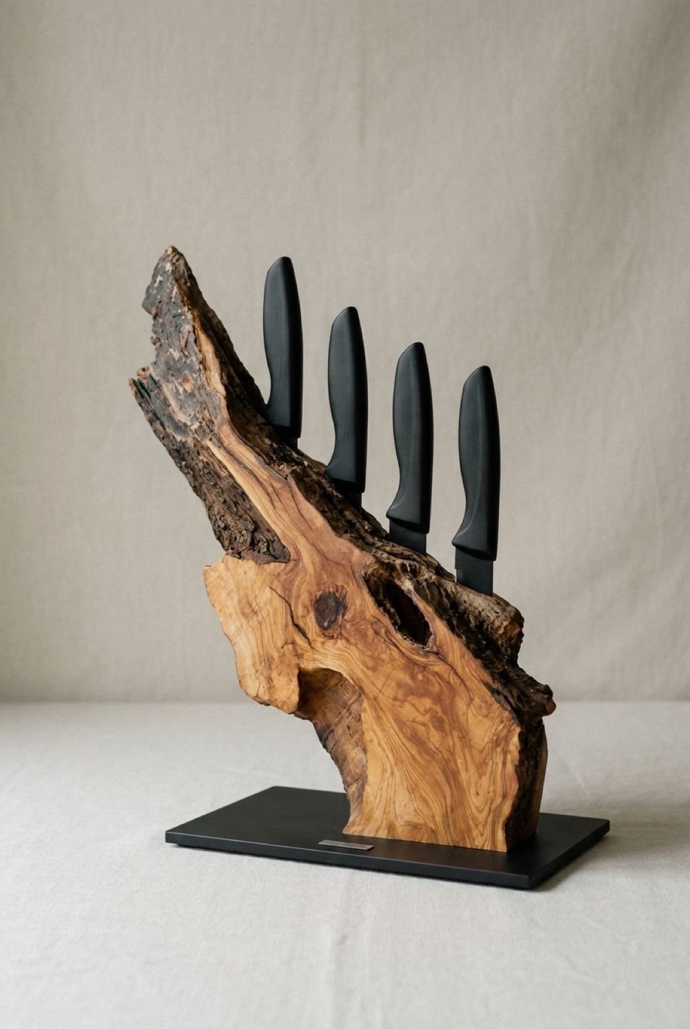 Bark-edge knife block on black steel base