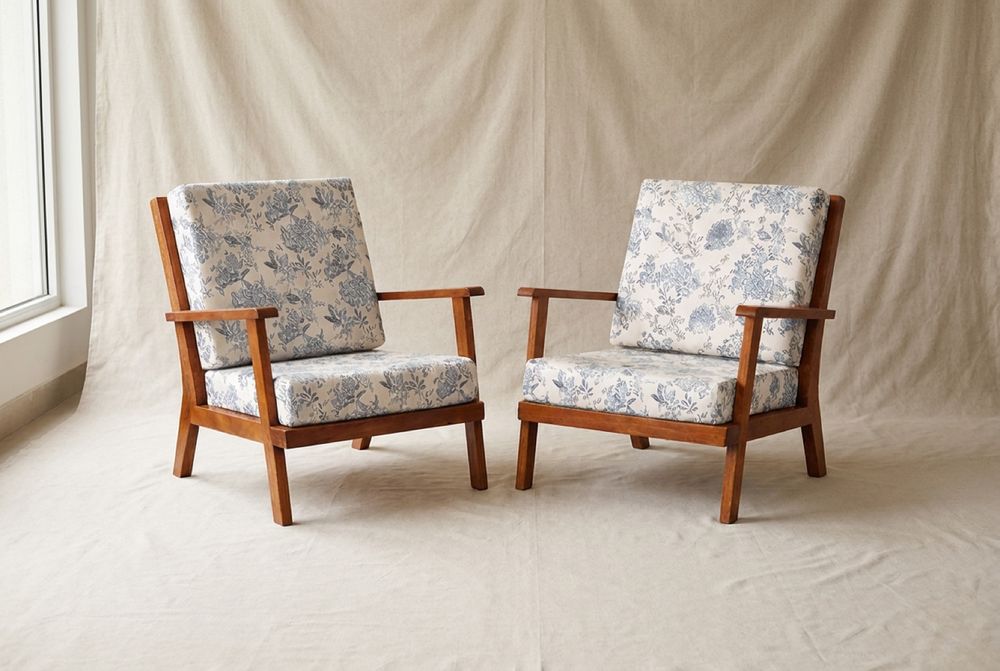 Pair of open-frame armchairs, floral linen cushions